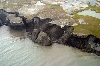 <a href="/earth/polar/cryosphere_permafrost1.html&edu=high">Permafrost</a> is
ground that is below the freezing point of water (0C or 32F) for two
or more years. Permafrost is found at high latitudes like the
<a href="/earth/polar/polar_north.html&edu=high">Arctic</a> and
<a href="/earth/polar/polar_south.html&edu=high">Antarctic</a>.
It is also common at high altitudes - like mountainous areas wherever the
<a href="/earth/climate/cli_define.html&edu=high">climate</a> is
cold. 
Permafrost has been thawing relatively quickly in recent years. Scientists
have found that the rate of permafrost thaw has increased because of <a href="/earth/climate/cli_effects.html&edu=high">global
warming</a>.<p><small><em>Image courtesy of the    USGS</em></small></p>